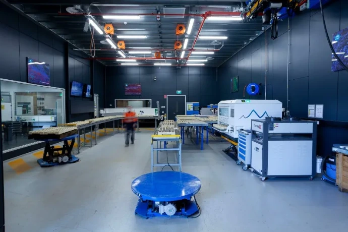 Core processing lab with conveyor tables and scanning equipment